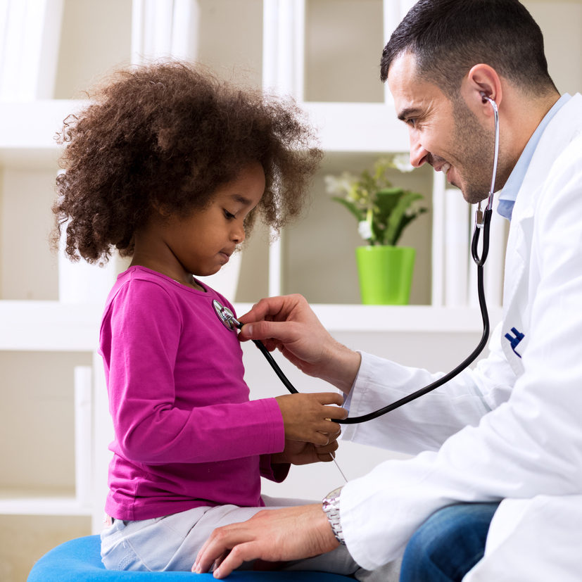 Pediatrician and little african girl at hospital